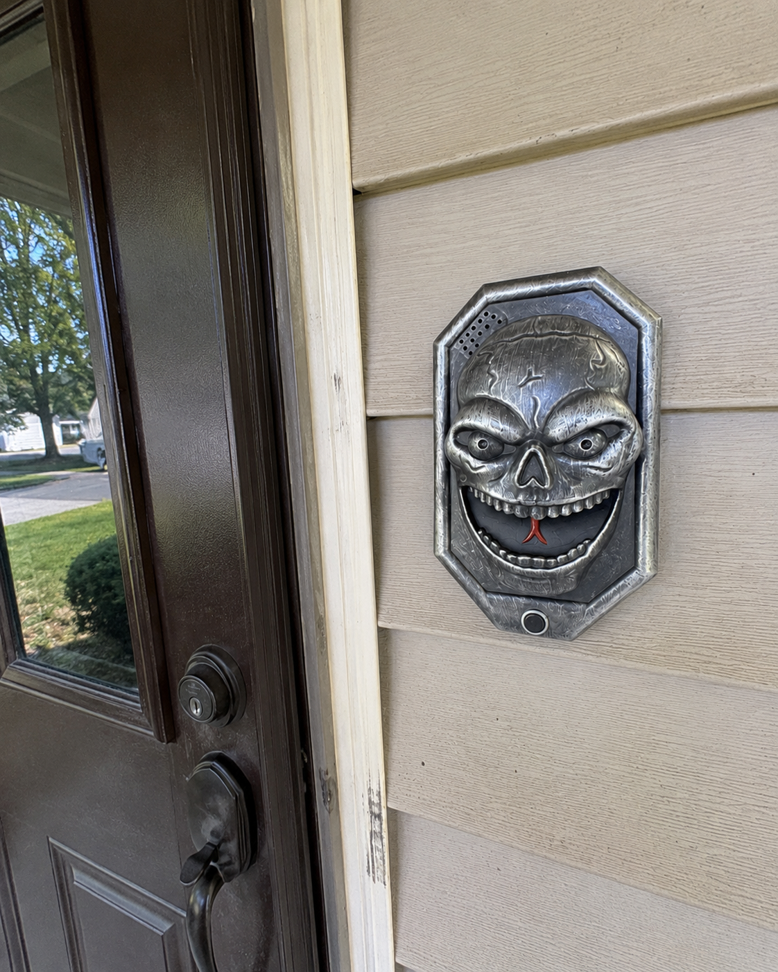 Customer photo of a Black Skull Prank Ding-Dong mounted beside a front door